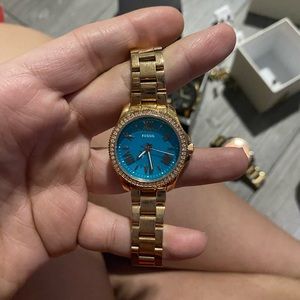 Gold and teal Fossil watch